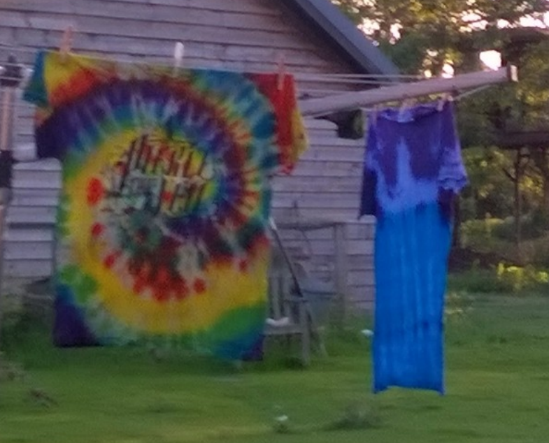 Tie-dyed Pierce The Veil shirt hanging up outdoors