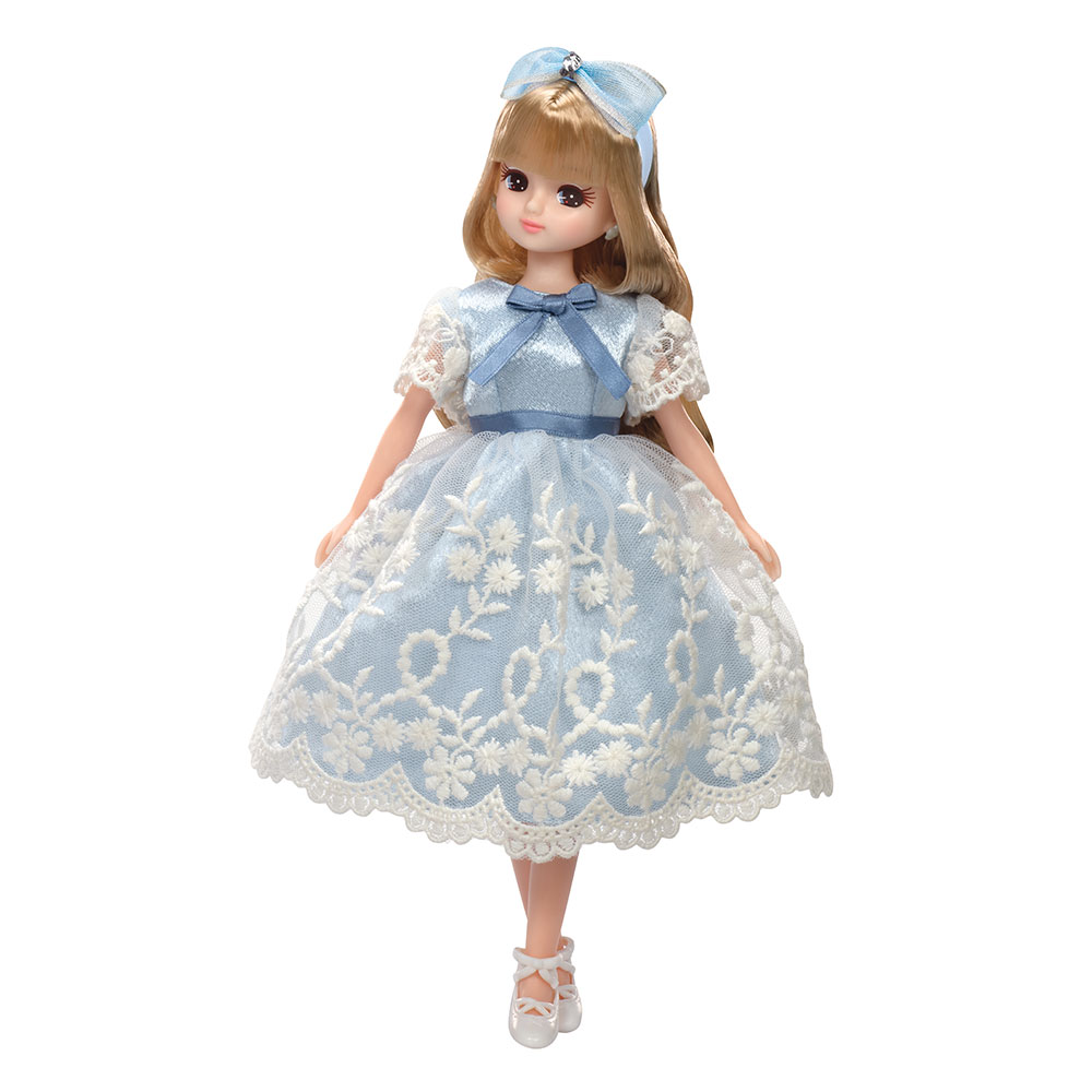 licca chan doll wearing classic pale blue dress with white lace trim.